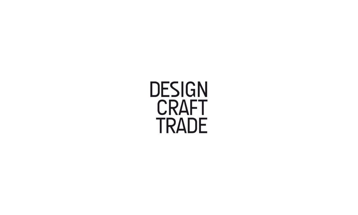 Logo von a-tec Design Craft Trade mit der vertikal angeordneten Wortmarke „DESIGN CRAFT TRADE“ in schwarzer Typografie auf weißem Hintergrund.