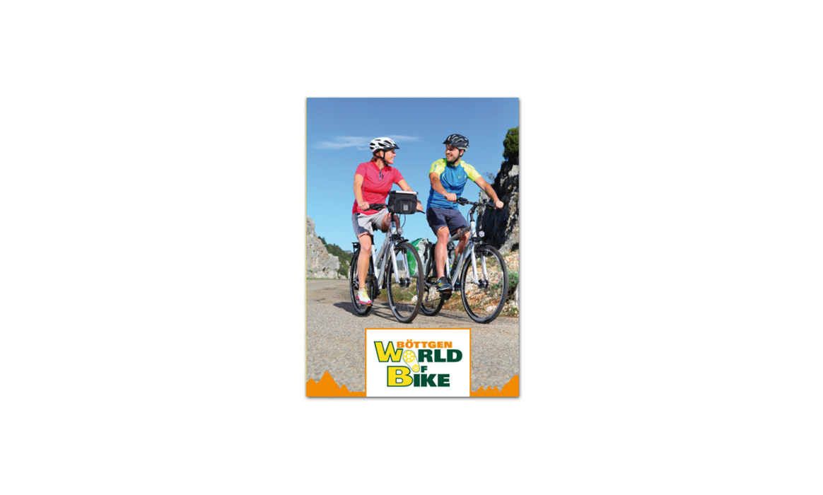 Titelseite des Flyers von World of Bike mit zwei Mountainbikern sowie dem Logo „World of Bike“.